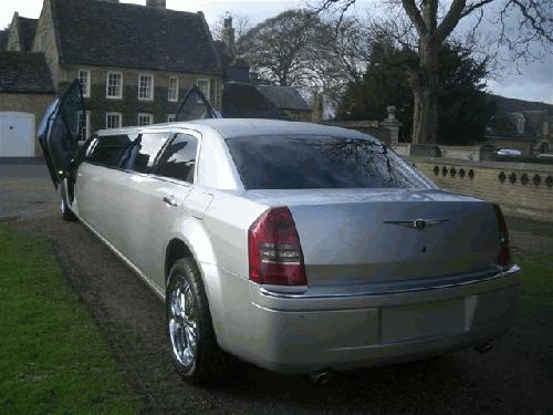 Chauffeur stretch Chrysler C300 Baby Bentley limousine with Lamborghini doors in East of England, Peterborough, Huntingdon, Stanford, King's Lynn, Norwich, Great Yarmouth, Lowestoft, Wisbech, Spalding, Cambridge, Cambridgeshire, Bedford, Bedfordshire, Newmarket, Bury St Edmunds, Suffolk, Norfolk, Lincolnshire, Northampton, Northamptonshire, Kettering, Leicester and Sudbury.