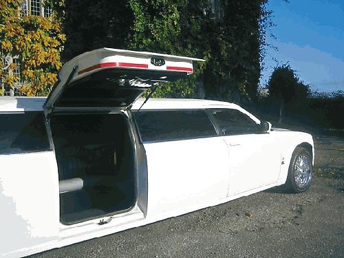 Chauffeur driven stretch limousine white Chrysler C300 Baby Bentley with jet doors available in Brighton, Eastbourne, Hastings, Portsmouth, Crawley, Tunbridge Wells, Lewes, Worthing, Chichester, Bognor Regis, Horsham, East Grinstead, East Sussex and West Sussex.