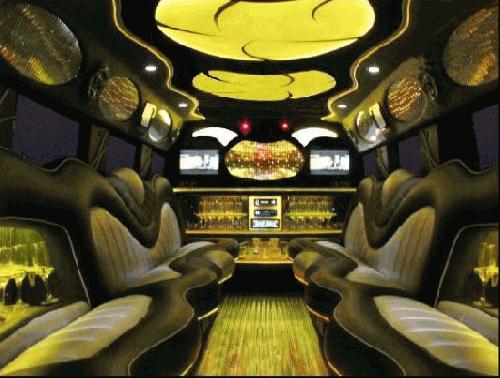 Chauffeur driven stretch yellow 8-wheeler triple axle H2 hummer limousine interior in Manchester, Liverpool, Cheshire, Chester, Stockport, North West, Blackburn, Preston, Bolton, Wigan, Lancashire.