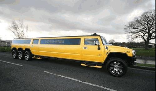 Chauffeur stretched yellow 8-wheeler triple axle H2 hummer limo in Manchester, Liverpool, Cheshire, Chester, Stockport, North West, Blackburn, Preston, Bolton, Wigan, Lancashire.