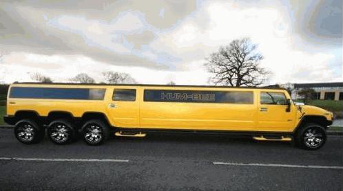 Chauffeur driven stretch yellow 8-wheeler triple axle H2 hummer limousine in Manchester, Liverpool, Cheshire, Chester, Stockport, North West, Blackburn, Preston, Bolton, Wigan, Lancashire.