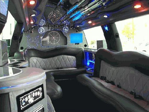 Chauffeur driven stretch silver Range Rover Vogue limousine 8 seater interior in East of England, Peterborough, Huntingdon, Stanford, King's Lynn, Norwich, Great Yarmouth, Lowestoft, Wisbech, Spalding, Cambridge, Cambridgeshire, Bedford, Bedfordshire, Newmarket, Bury St Edmunds, Suffolk, Norfolk, Lincolnshire, Northampton, Northamptonshire, Kettering, Leicester and Sudbury.