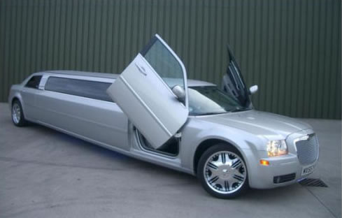 Chauffeur stretch silver Chrysler C300 Baby Bentley limousine hire with Lamborghini doors in Nottingham, Derby, Leicester, Birmingham, Nottinghamshire, Derbyshire, Midlands.