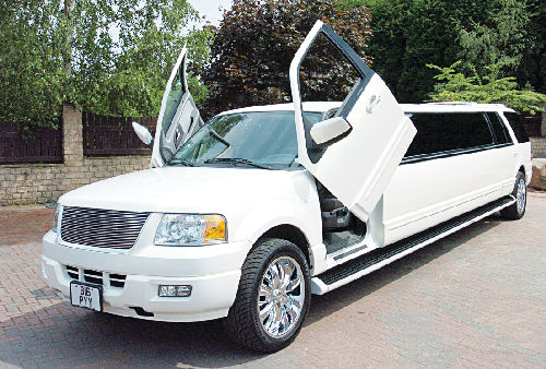 Chauffeur stretched white Ford Excursion 4x4 limo hire with Lamborghini doors in Sheffield, Rotherham, Barnsley, Doncaster, Huddersfield, South Yorkshire.