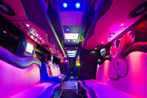 Chauffeur driven Party Bus limo hire Playboy den interior in Bristol, Gloucester, Cheltenham, Cardiff, Wales, Weston Super Mare, and Bath.