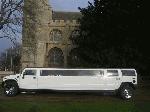 Chauffeur driven stretched white H2 hummer limousine 16 seater in East of England, Peterborough, Huntingdon, Stanford, King's Lynn, Norwich, Great Yarmouth, Lowestoft, Wisbech, Spalding, Cambridge, Cambridgeshire, Bedford, Bedfordshire, Newmarket, Bury St Edmunds, Suffolk, Norfolk, Lincolnshire, Northampton, Northamptonshire, Kettering, Leicester and Sudbury.