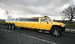 Chauffeur stretched yellow 8-wheeler triple axle H2 hummer limo in Manchester, Liverpool, Cheshire, Chester, Stockport, North West, Blackburn, Preston, Bolton, Wigan, Lancashire.