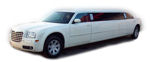 Chauffeur stretched white Chrysler C300 Baby Bentley limo hire in UK.