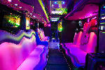 Chauffeur driven Party Bus limousine hire Playboy den interior in Bristol, Gloucester, Cheltenham, Cardiff, Wales, Weston Super Mare, and Bath.