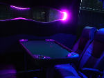 Chauffeur driven Party Bus limo hire Poker den interior in Bristol, Gloucester, Cheltenham, Cardiff, Wales, Weston Super Mare, and Bath.